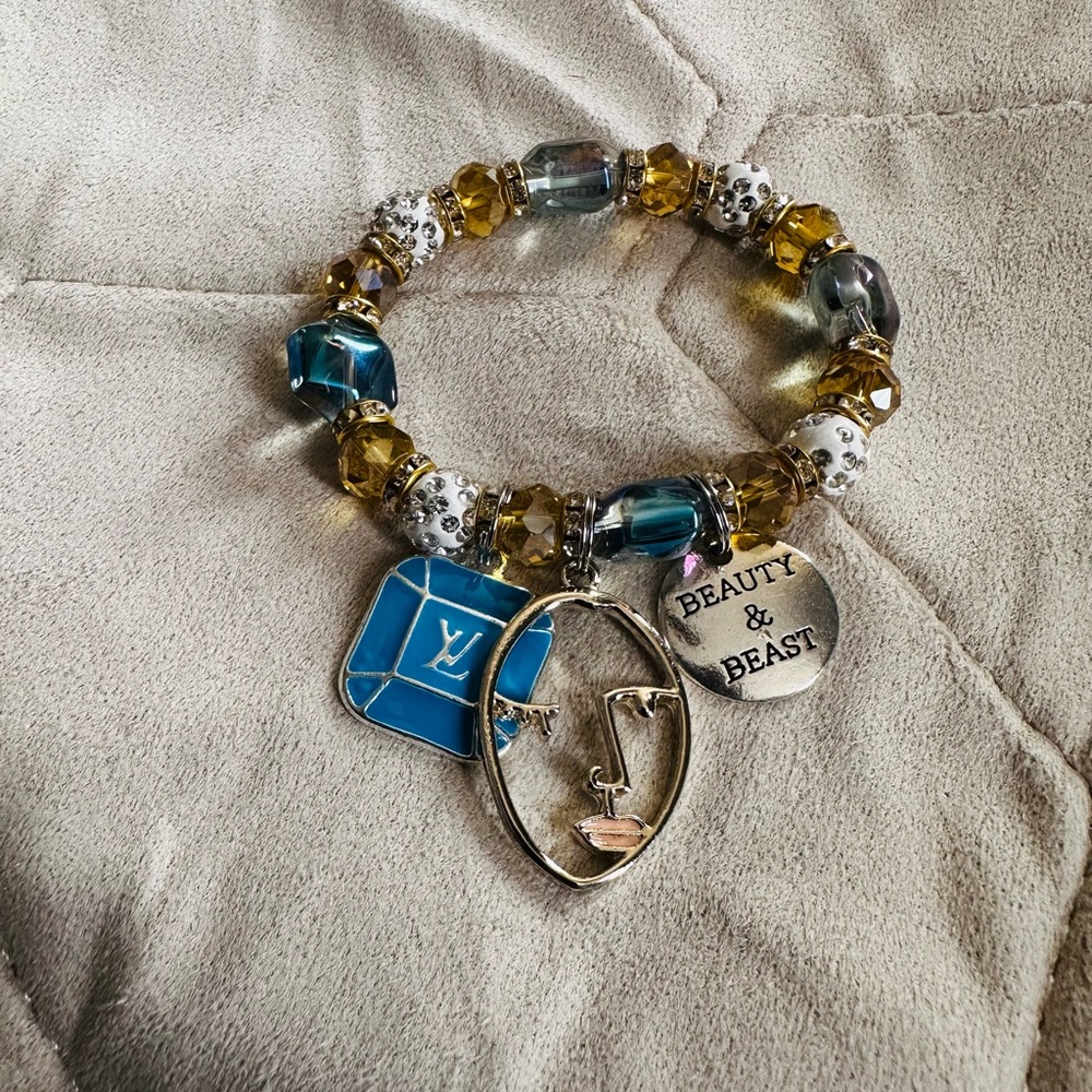 Elegant Gold and Blue Charm Bracelet